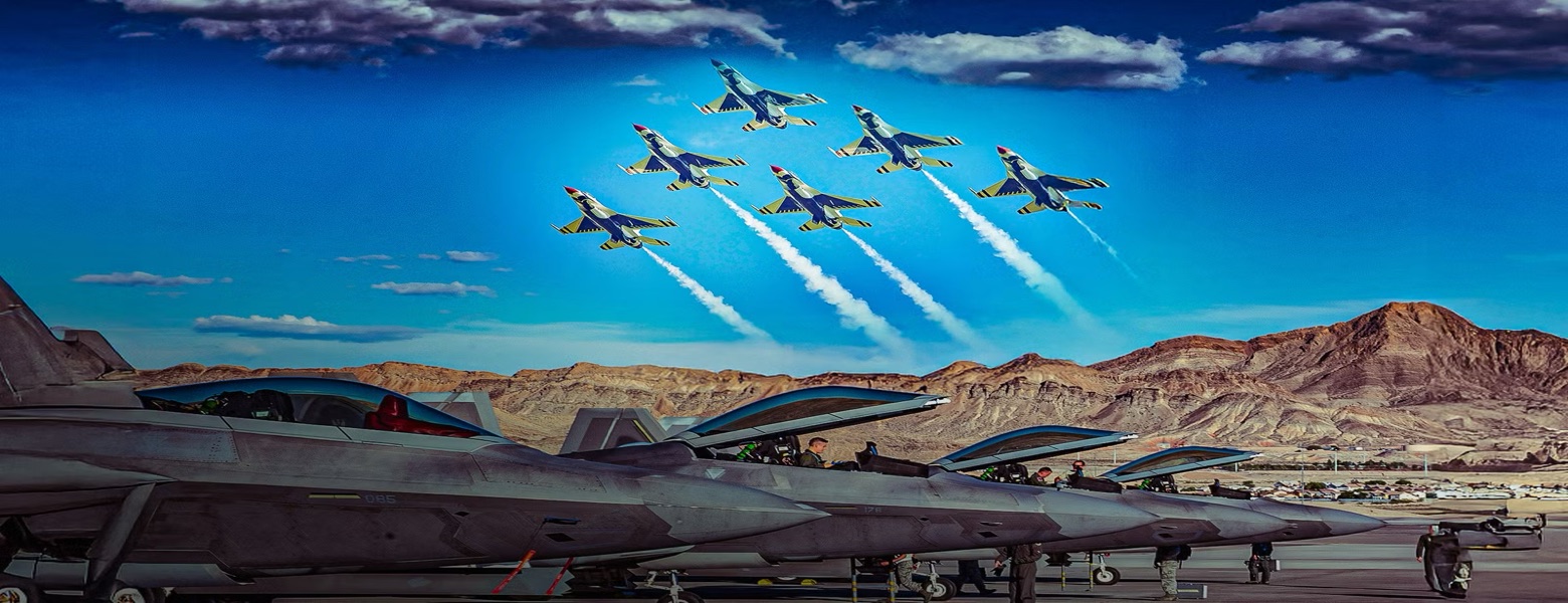 Ground crew working along a line of parked aircraft while a formation passes overhead